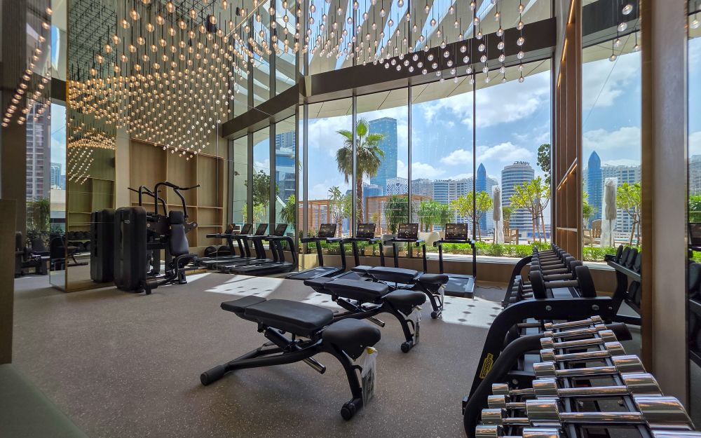 A large modern gym with city views